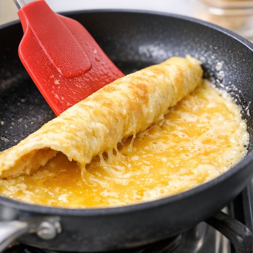 Step 5: Gently Lift and Let Uncooked Eggs Flow